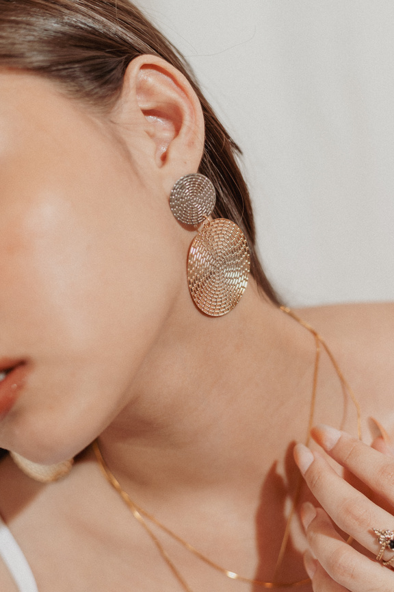 Closeup Portrait of a Woman Wearing Gold Accessories